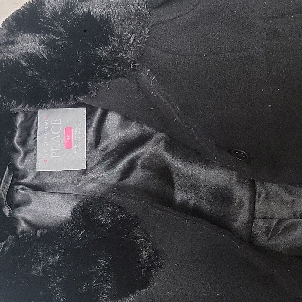 The children place 4T coat